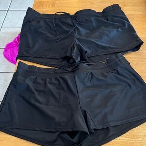 Two pair of black swim shorts